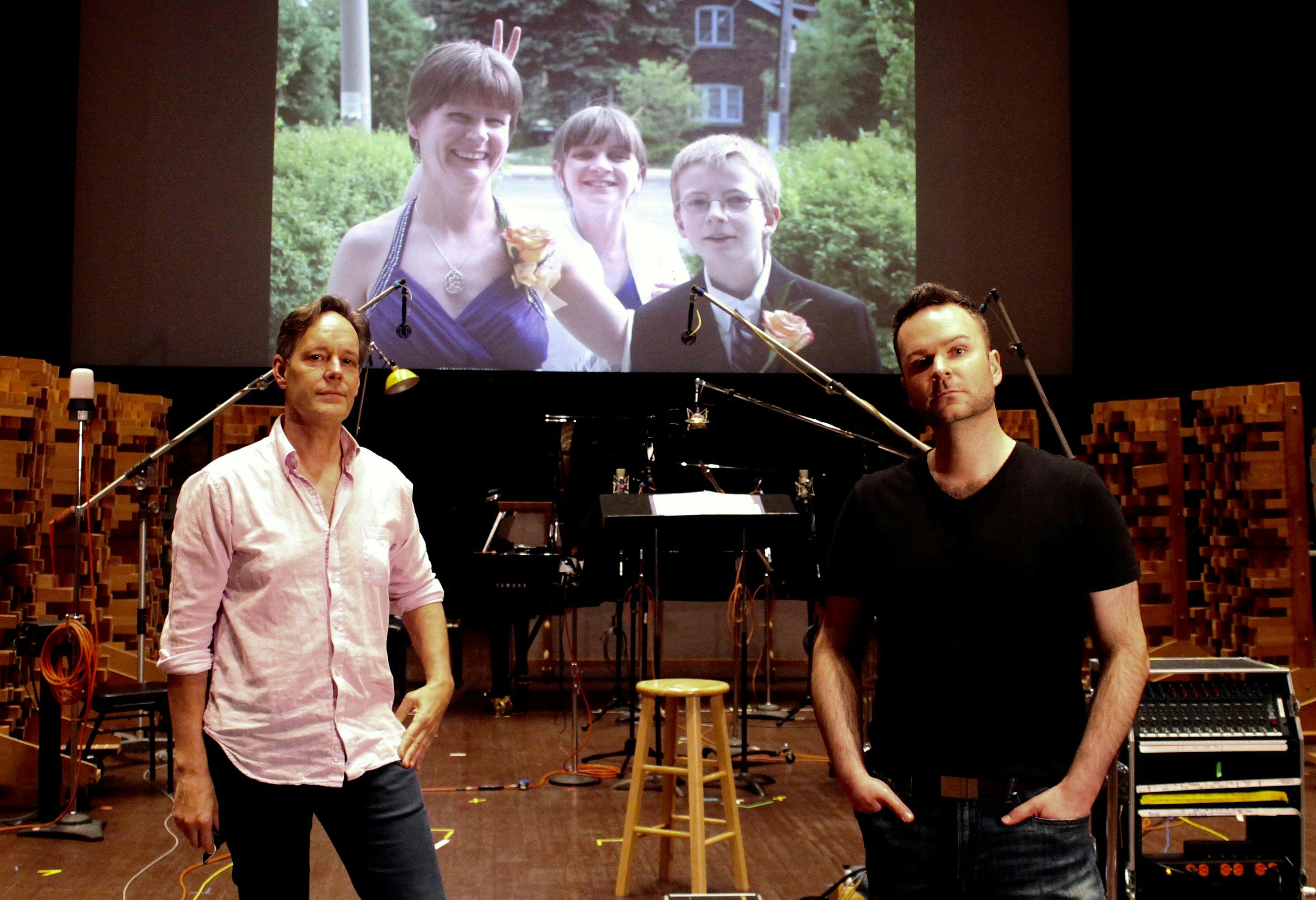 Composer Jake Heggie and Joshua (foreground) on scoring stage of Skywalker Sound with an image of Joshua's sister Nathalie and her two children (background). PHOTO BY ZOE TARSHIS